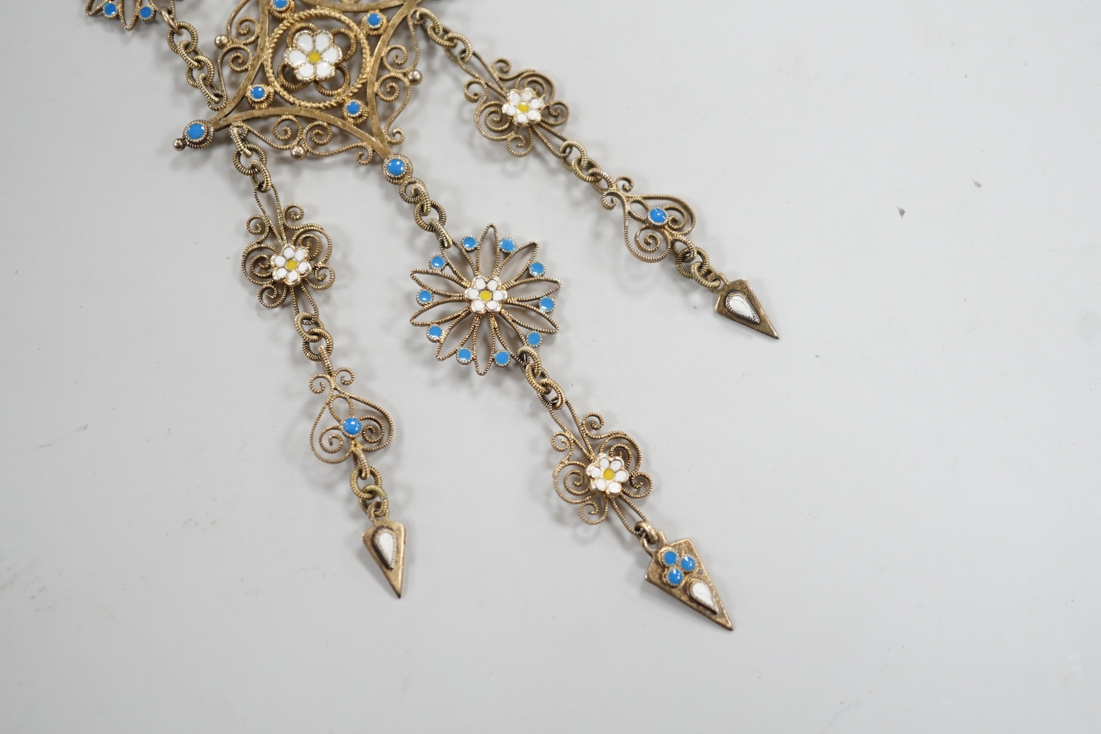 An early 20th century Scandinavian 830s gilt white metal and three colour enamel set drop brooch, 11cm, gross weight 16.3 grams.